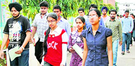 Students come out after taking the IIT-JEE at a centre at DAV Public School, Sector 15, in Chandigarh on Sunday.
