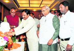 Chief Minister Ramesh Pokhriyal Nishank garlands a statue of Dr Hahnemann, the father of homoeopathy, to celebrate his birth anniversary in Dehradun on Sunday