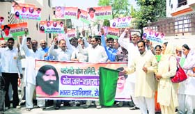 Activists of the Patanjali Yoga Samiti and Bharat Swabhiman hold an awareness rally in Rohtak on Sunday