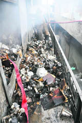 Gutted electrical parts, fittings and components on the second floor of the storehouse in Ludhiana on Sunday.
