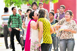 A mother kisses her daughter soon after she emerged from an examination centre after appearing for the IIT entrance exam in Ludhiana on Sunday.