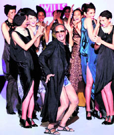 Models applaud as designer James Ferreira dances to Sheila ki Jawanii during his show at Wills Lifestyle India Fashion Week in New Delhi on Friday
