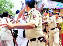 Police CANE-charge RPI activists during a protest against actor Anupam Kher's alleged anti-constitutional remarks in Mumbai on Sunday