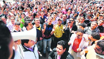 People protest against military chief Hussein Tantawi, in charge since president Hosni Mubaraks ouster, at Tahrir Square on Sunday.