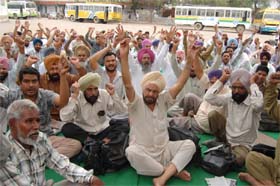 Members of the PRTC Workers Union staging a dharna in Bathinda on Monday