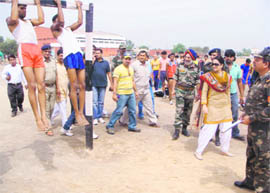 Public Health Minister Kiran Choudhry at a physical test being conducted for recruitment to the Army at Bhim Stadium in Bhiwani 