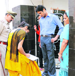 Police personnel check the antecedents of tenants during a surprise check at Shiv Colony in Karnal 
