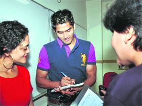Boxing champion Vijender Singh gives autographs in Gurgaon.