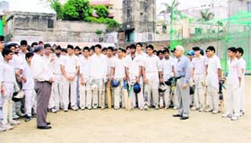 Aspirants take part in trials organised by the Ludhiana Distict Cricket Association at Arya College in Ludhiana on Monday