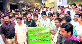 Non-resident Indians from Dubai, who will cast their votes for the first time during the Assembly elections, being welcomed on their arrival at the Calicut airport in Kozhikode on Sunday.