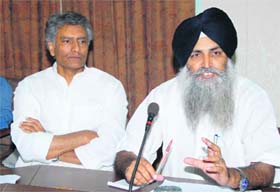 Vidhan Sabha committee members Virsa Singh Valtoha and Sunil Jakhar interact with mediapersons in Bathinda on Monday