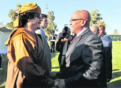 S. African President Jacob Zuma with Gaddafi on his arrival in Libya on Sunday.