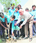 Col Deepak Nayyar (retd) waters a plant at Nishkam Sewa Public School in Amritsar. 