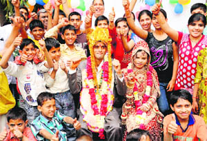 Manoj and Meera, hearing and speech impaired, who were adopted and raised by Sri Durga Foundation, tie the nuptial knot in Chandigarh on Tuesday. 