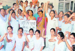 Nurses of Ayurvedic and Unani Nursing Union protest at Rishikul College in Haridwar. 