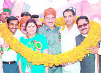 PCC chief Kaul Singh Thakur being garlanded by Congressmen during a Dalit rally at Paplohl in Hamirpur district on Tuesday. 