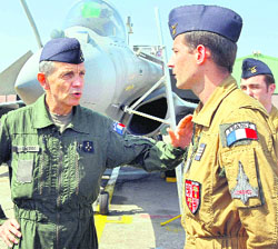 France air force chief of staff, Gen Jean-Paul Palomeros, talks to the pilots of Rafale jet fighter prior to his take off for a mission to Libya, at Solenzara 126 Air Base, on Corsica Island.