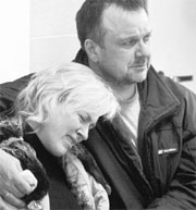Relatives of the recent metro station blast victims cry at a hospital in Minsk on Tuesday.