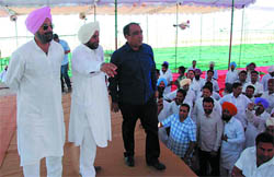 Congress leader Raninder Singh oversees arrangements for the rally