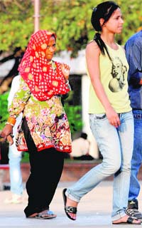 A girl in jeans and a woman in ethnic attire in Chandigarh’s Sector 17 shopping complex