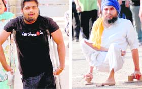 Kapil Budhiraja of Panipat (left) and Sohan Singh of Mohali come to watch the match