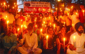 Members of the Shiromani Akali Dal take out a candlelight march against the alleged deterioration in education standards of Guru Harkishan Public Schools run by the Delhi Sikh Gurdwara Management Committee in New Delhi on Wednesday