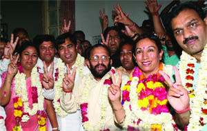 BJP candidate for the post of mayor, Rajni Abbi (2R) and deputy mayor Anil Kr Sharma (R) with the party supporters after filing their nominations at Town Hall in Delhi on Wednesday