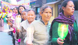 Members of the Tibetan Women Congress take out a candlelight march in Mussoorie