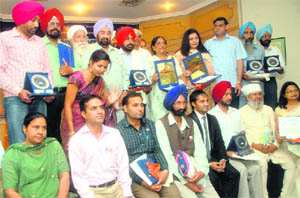 Cooperation Minister HS Chatha with the Haryana Punjabi Sahit Akademi awardees at a function in Chandigarh on Wednesday