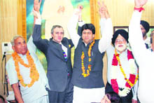 Chief Minister Omar Abdullah with the candidates of his party, who were elected as MLCs, in Jammu on Wednesday.
