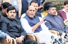 Senior BJP leaders address a press conference in Srinagar on Wednesday. 
