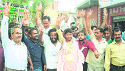 Ramesh Kumar Attri, who was the first one to be declared elected as sarpanch of the Rount panchayat, with his supporters outside the office of the Block Development Officer at Udhampur on Wednesday. 