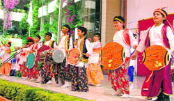 Children attired in traditional dresses dance on dhol beats on the eve of Baisakhi in Ludhiana on Wednesday