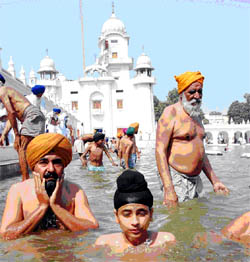 Devotees taking a dip in the holy sarovar