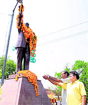 People pay tributes to Dr Ambedkar on his 120th birth anniversary in Karnal on Thursday.