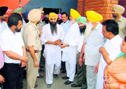 A jail inmate, who was given amnesty, being greeted by Jail Minister Hira Singh Gabria (yellow turban, in centre) in Central Jail, Ludhiana, on Thursday