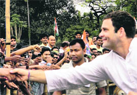 AICC General Secretary Rahul Gandhi greets supporters during an election meeting in Jalpaiguri on Thursday. 