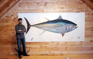 James Prosek in his New Haven, Connecticut studio, standing next to the life-size painting he has made of a bluefin tuna for a book to be published in 2012 by Rizzolli.