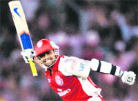 Kings batsman Paul Valthaty celebrates his hundred in Mohali