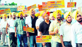 Sikh youths participate in a turban march to mark Sikh Dastar Diwas in Amritsar