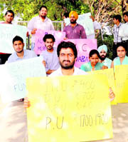 NSUI activists stage a protest at Panjab University, Chandigarh, on Friday.