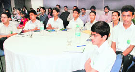Students listen to experts during the conference.