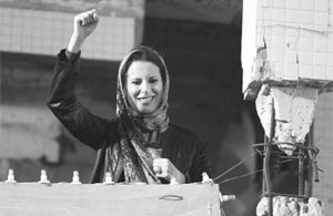 Aisha Gaddafi, daughter of Libyas leader Muammar Gaddafi, greets her fathers supporters at the heavily fortified Bab al-Aziziya compound in Tripoli on April 14, 2011.