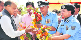 PK Dhumal, CM, receives flowers from police officials on Himachal Day function at Una.
