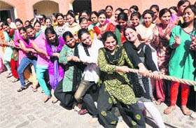 Students in action during the sports day meet at KCS College of Education in Jammu on Friday. 