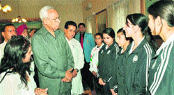 Governor NN Vohra interacts with medallists of the 34th National Gamesat Raj Bhawan in Jammu on Friday.