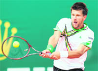 Austrias Jurgen Melzer hits a return to Switzerlands Roger Federer during the Monte Carlo ATP Masters Series Tournament in Monaco on Friday.