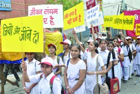 Schoolchildren take out a peace procession on the occasion of Mahavir Jayanti in Delhi on Saturday