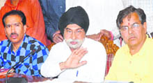 Members of the Verka Milk Bar Welfare Association address the media in Jalandhar on Saturday. 