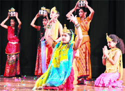 Children perform on stage during a function on Mahavir Jayanti at the General Zorawar Singh Auditorium at the University of Jammu 